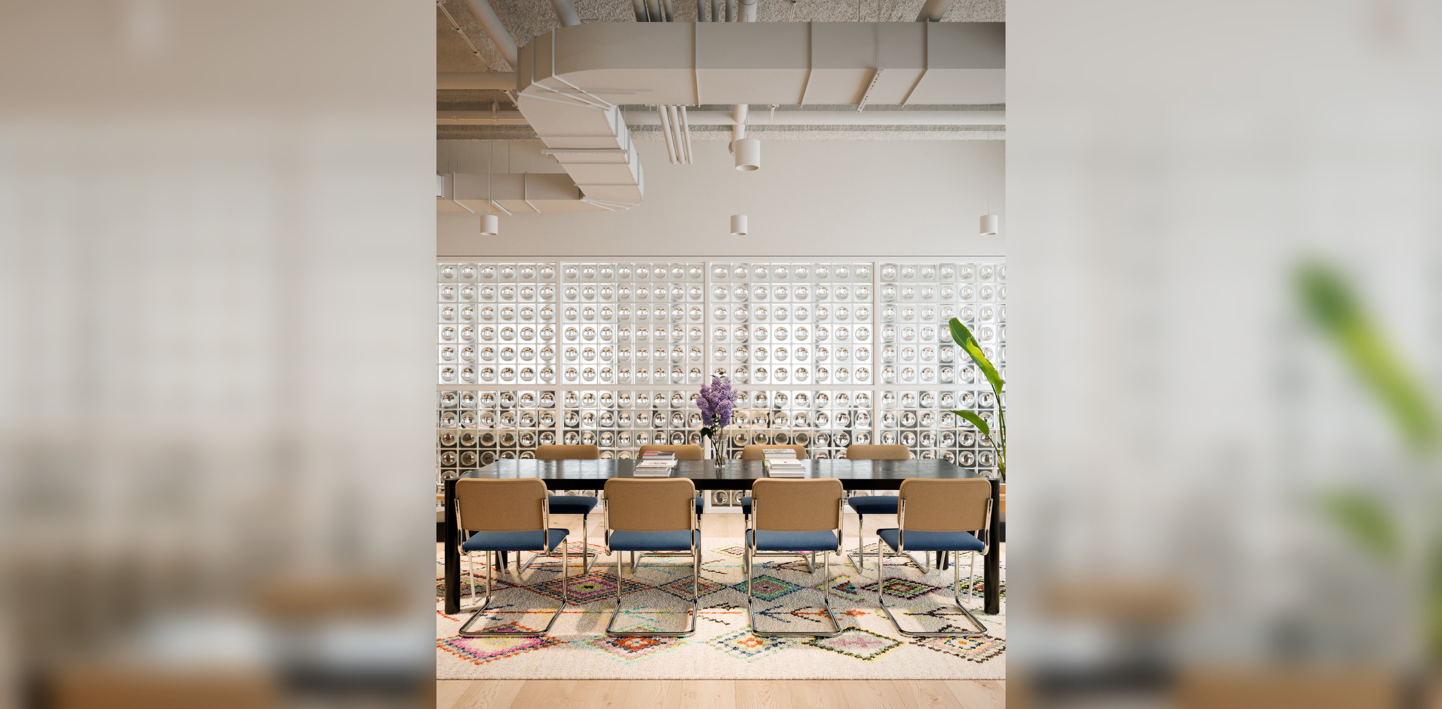 WeWork lounge interior with patterned screen wall.